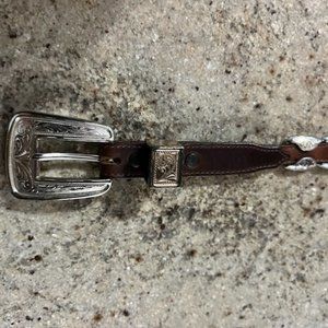 Vintage Ladies leather brown western belt with silver-like trim.  Justin.